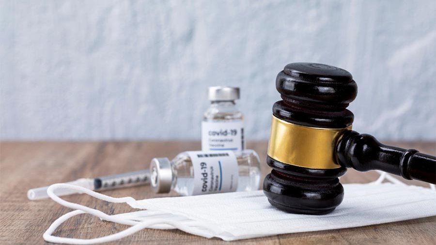 Gavel and vaccine bottle