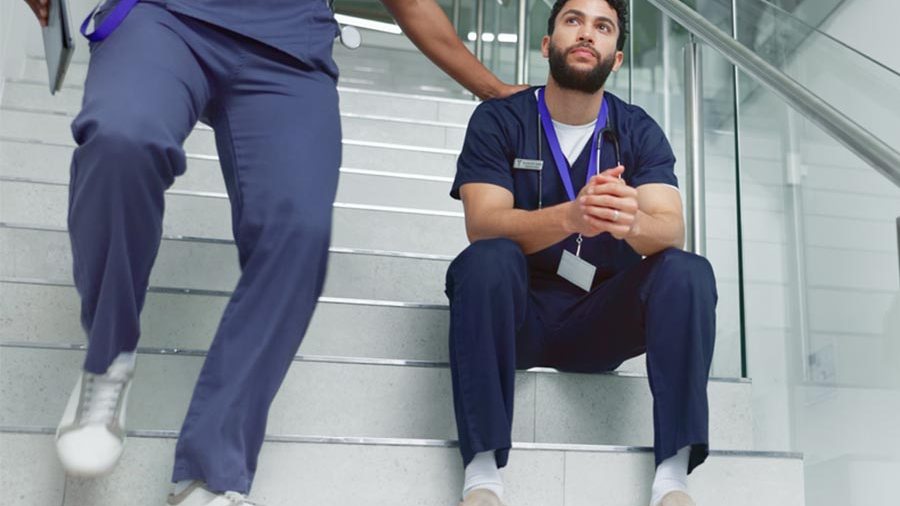 Physician sitting on steps