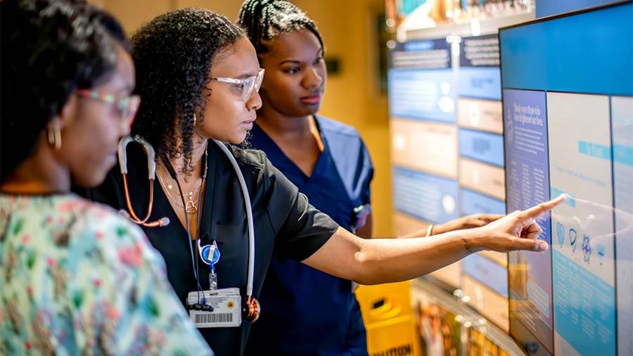 Medical workforce reviewing patient data