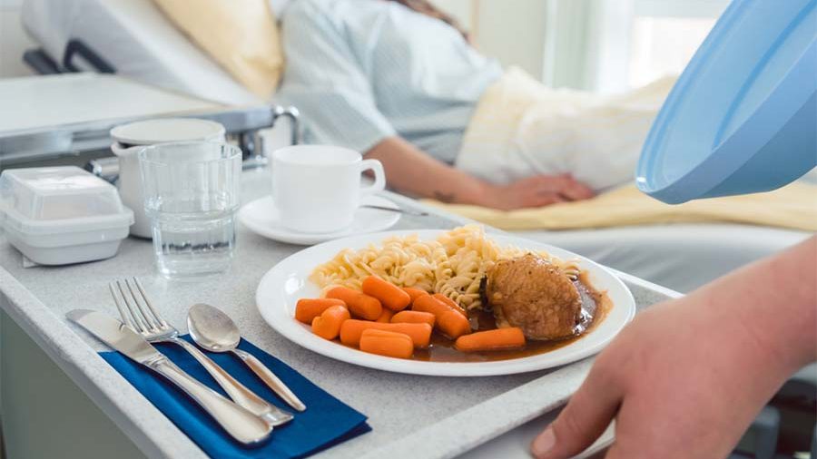 Patient receiving hospital food