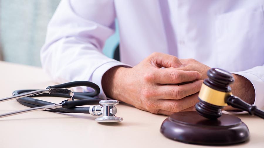 Doctor with stethoscope and gavel 