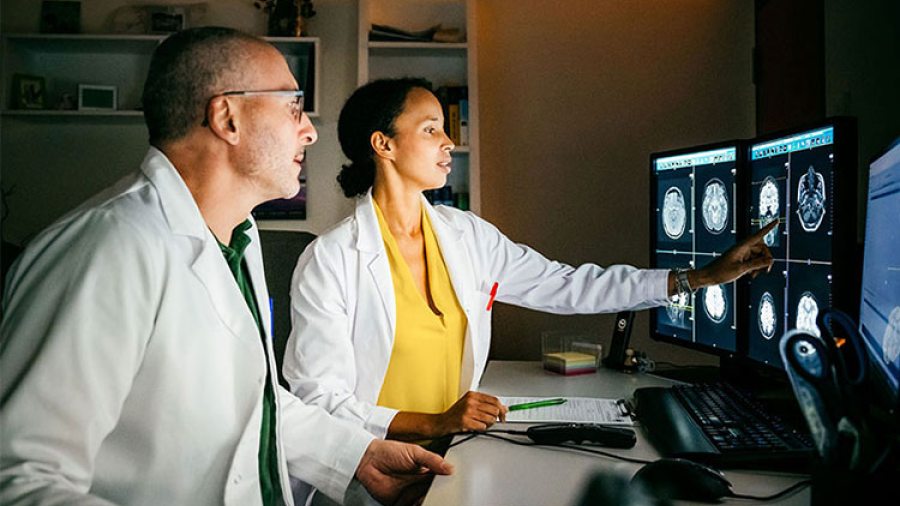 Physicians reviewing medical diagnostics