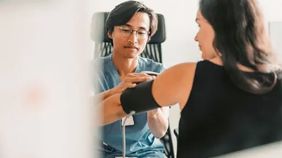 Woman getting blood pressure taken