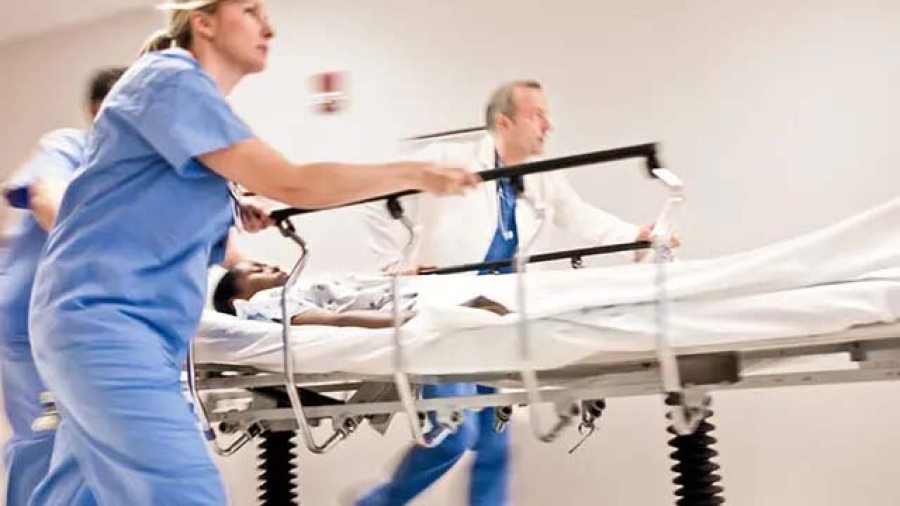 Doctors pushing gurney
