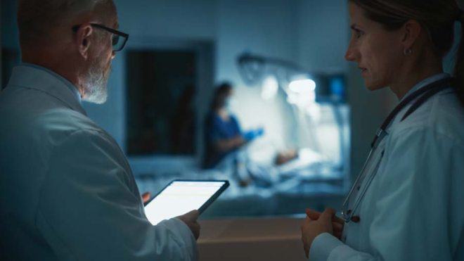 Doctors observing a patient