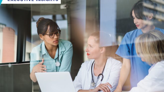 Healthcare workers reviewing executive insights