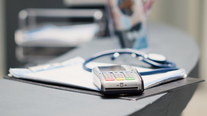 Hospital clipboard with forms and calculator
