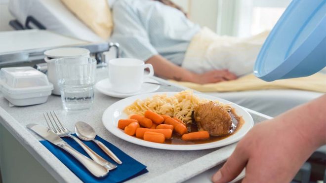 Patient receiving hospital food