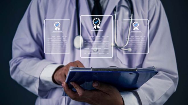 Physician holding paper work