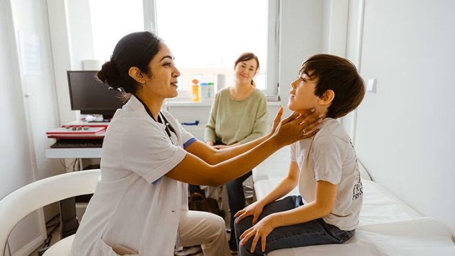 Pediatric nurse and child