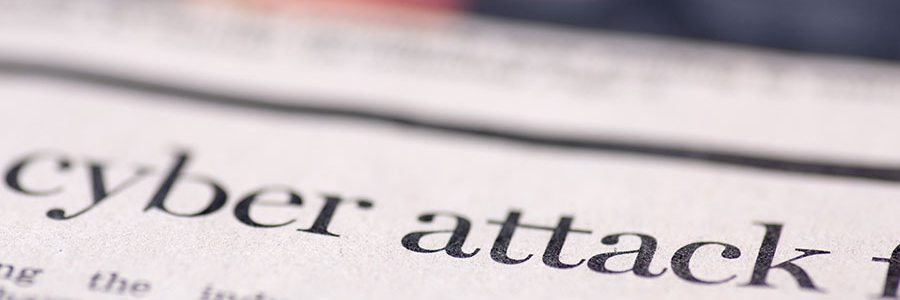 newspaper headline "cyber attack"