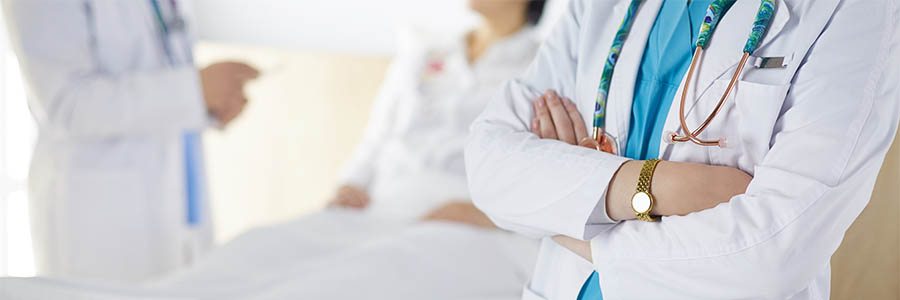 Doctor and physician assistant talking