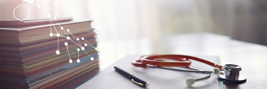 Books and a stethoscope 