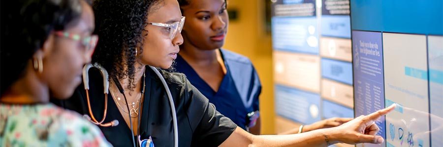 Medical workforce reviewing patient data