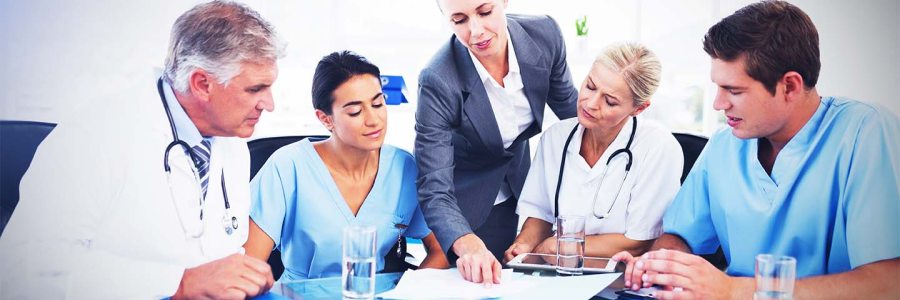 Healthcare consultant with medical team